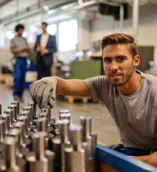 smiling-steel-worker-examining-manufactured-rod-cy-2022-12-01-05-27-51-utc-min